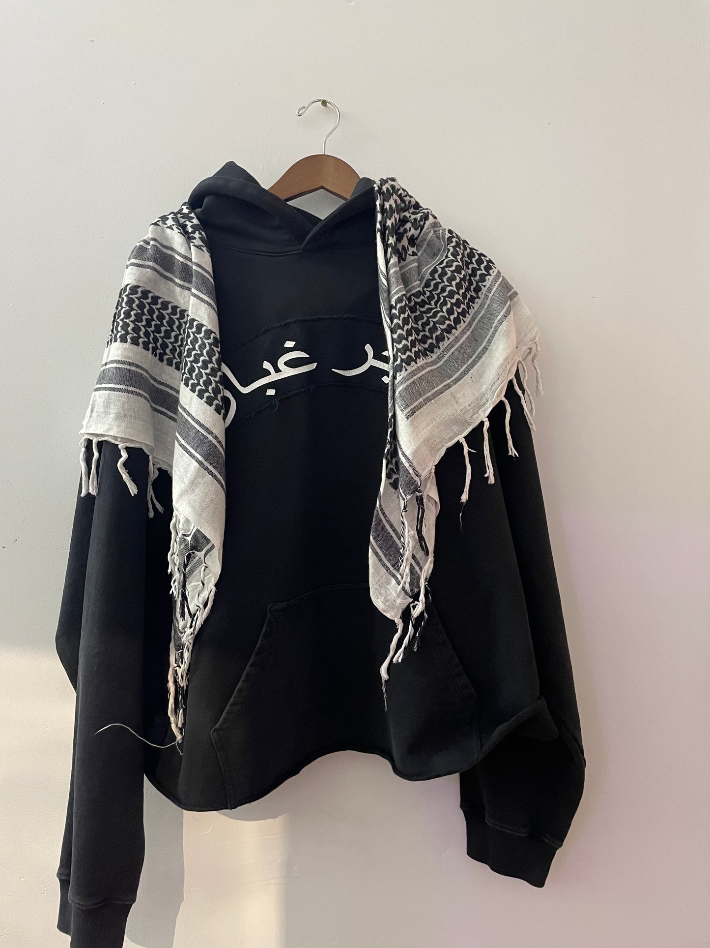 “Tajir Ghubar” Black Hoodie with White Scarf