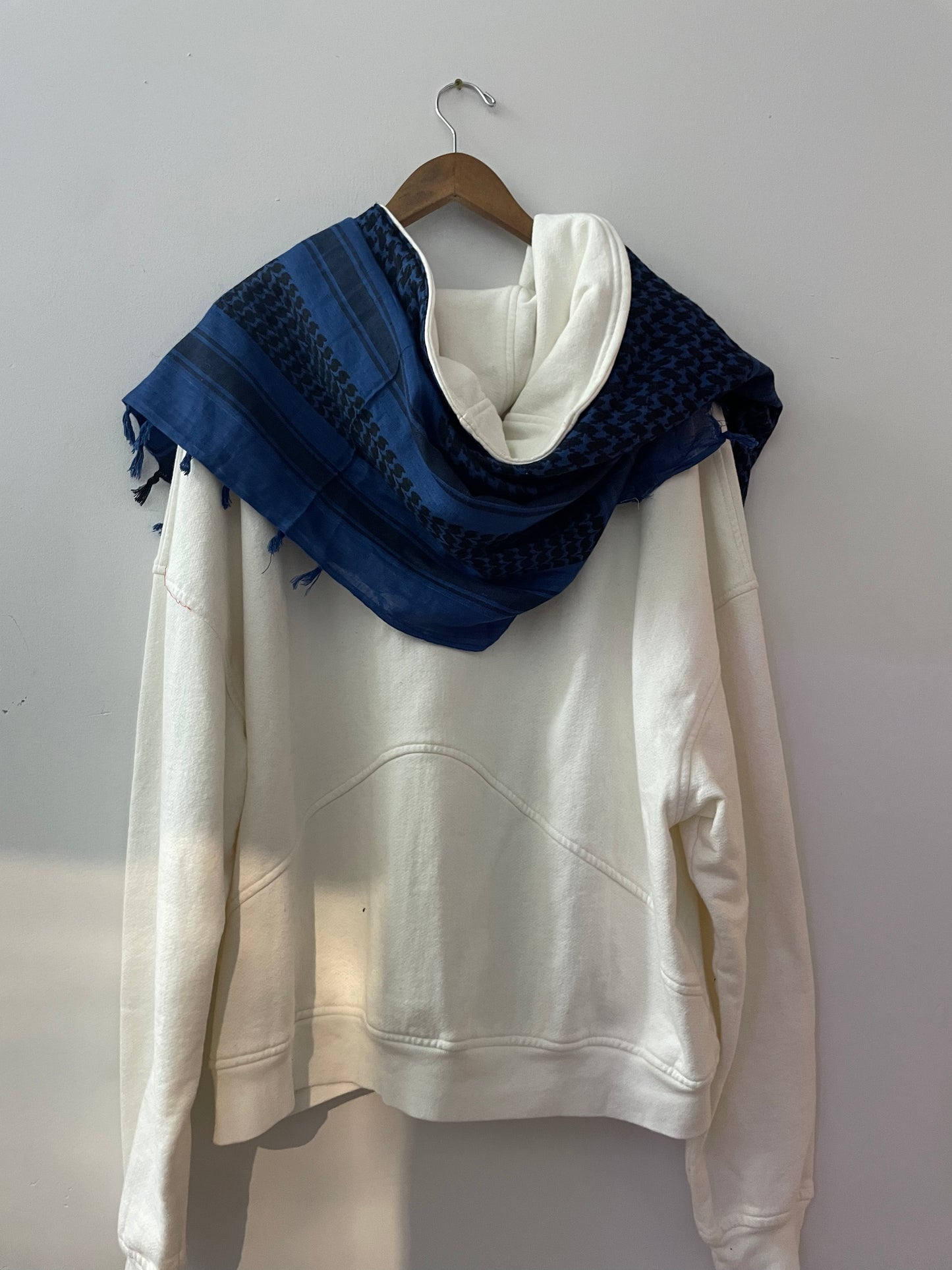 “Tajir Ghubar” White Hoodie with Blue Scarf